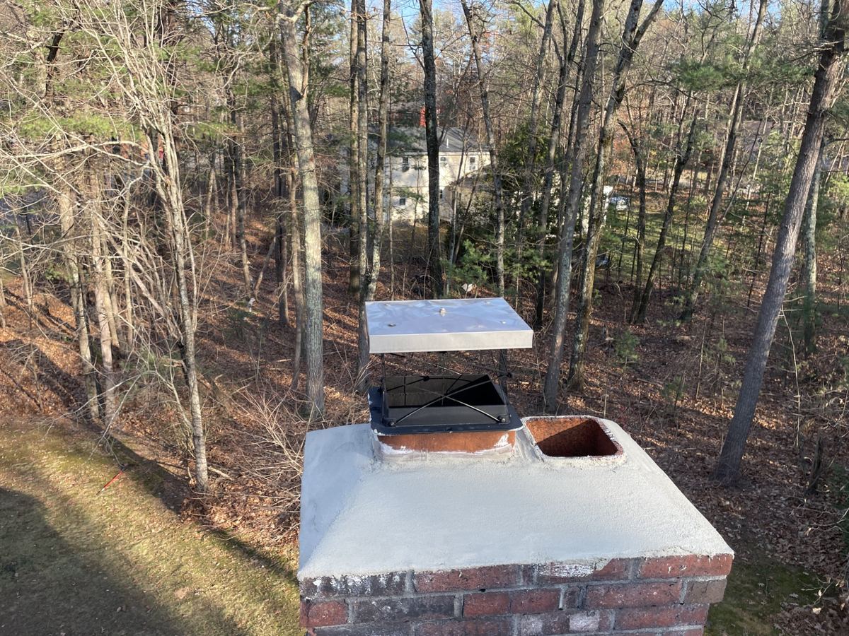 Stainless steel chimney cap installation in Greater Boston