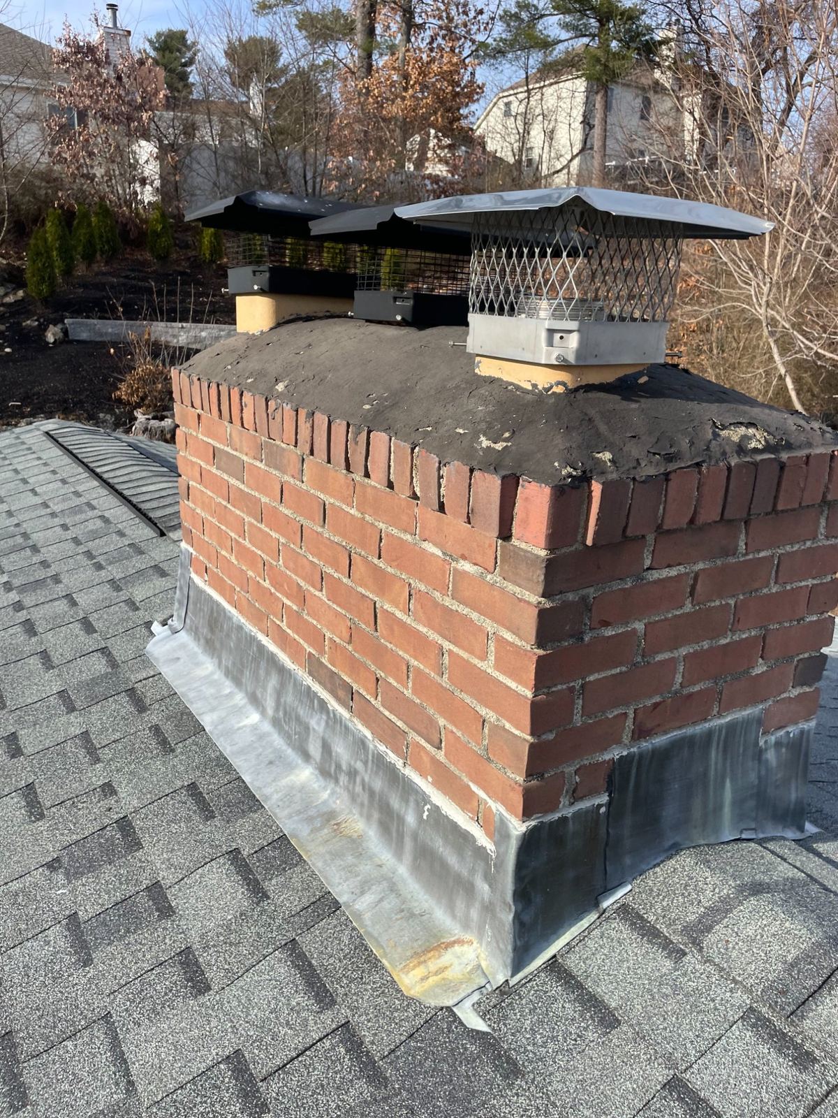 Chimney flashing and brick repair in Greater Boston