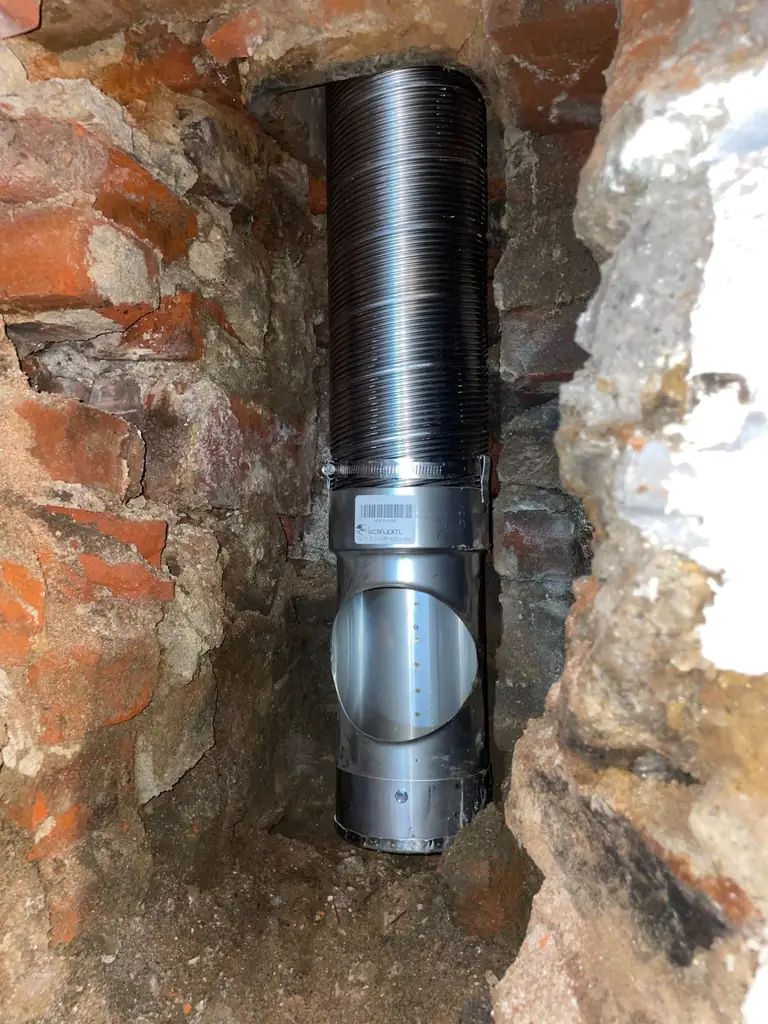Interior brickwork and flue in a chimney