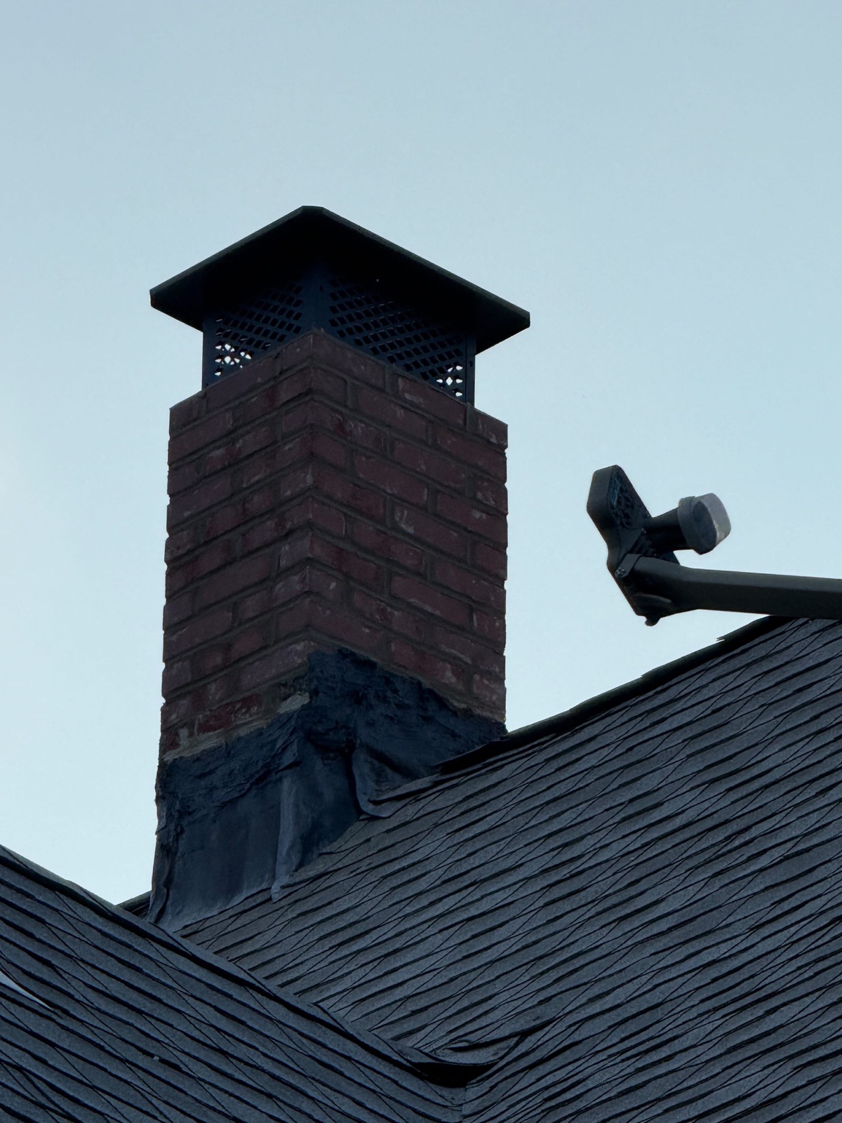 Finished chimney and cap viewed from the roof below
