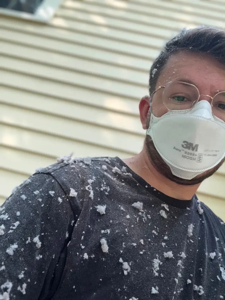 Technician after removing lint from dryer vent in Lexington MA
