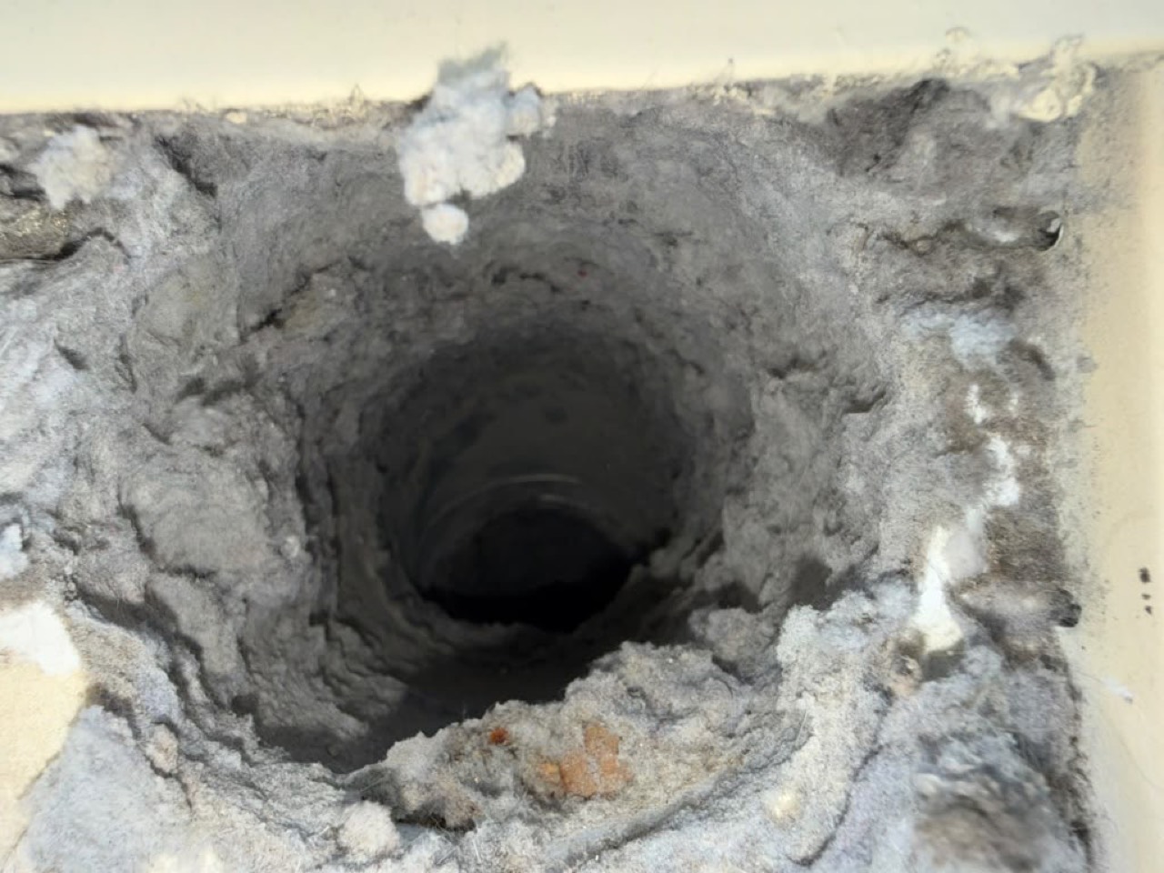 Lint buildup inside dryer vent before cleaning in Lexington MA