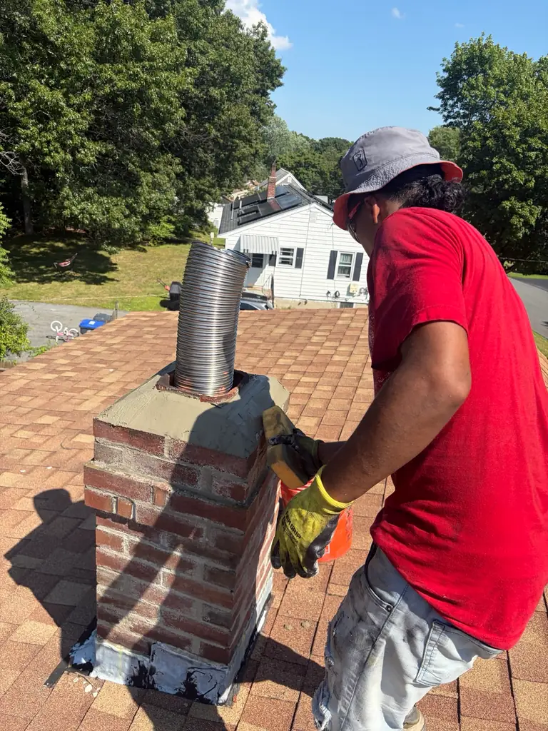 Concrete repair around new chimney liner in Methuen MA