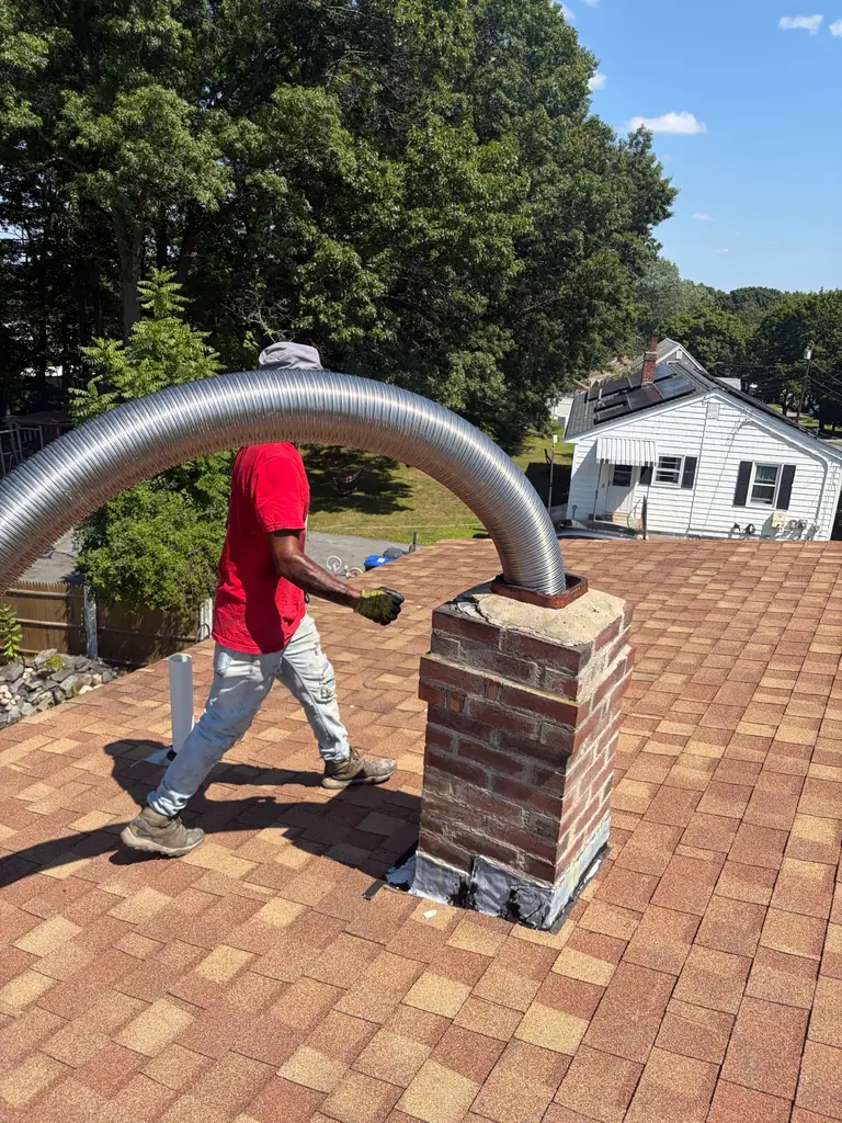 Flexible chimney liner being installed in Methuen MA