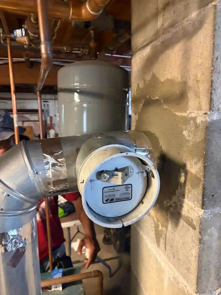 Heating system venting repair during chimney liner work in Methuen MA