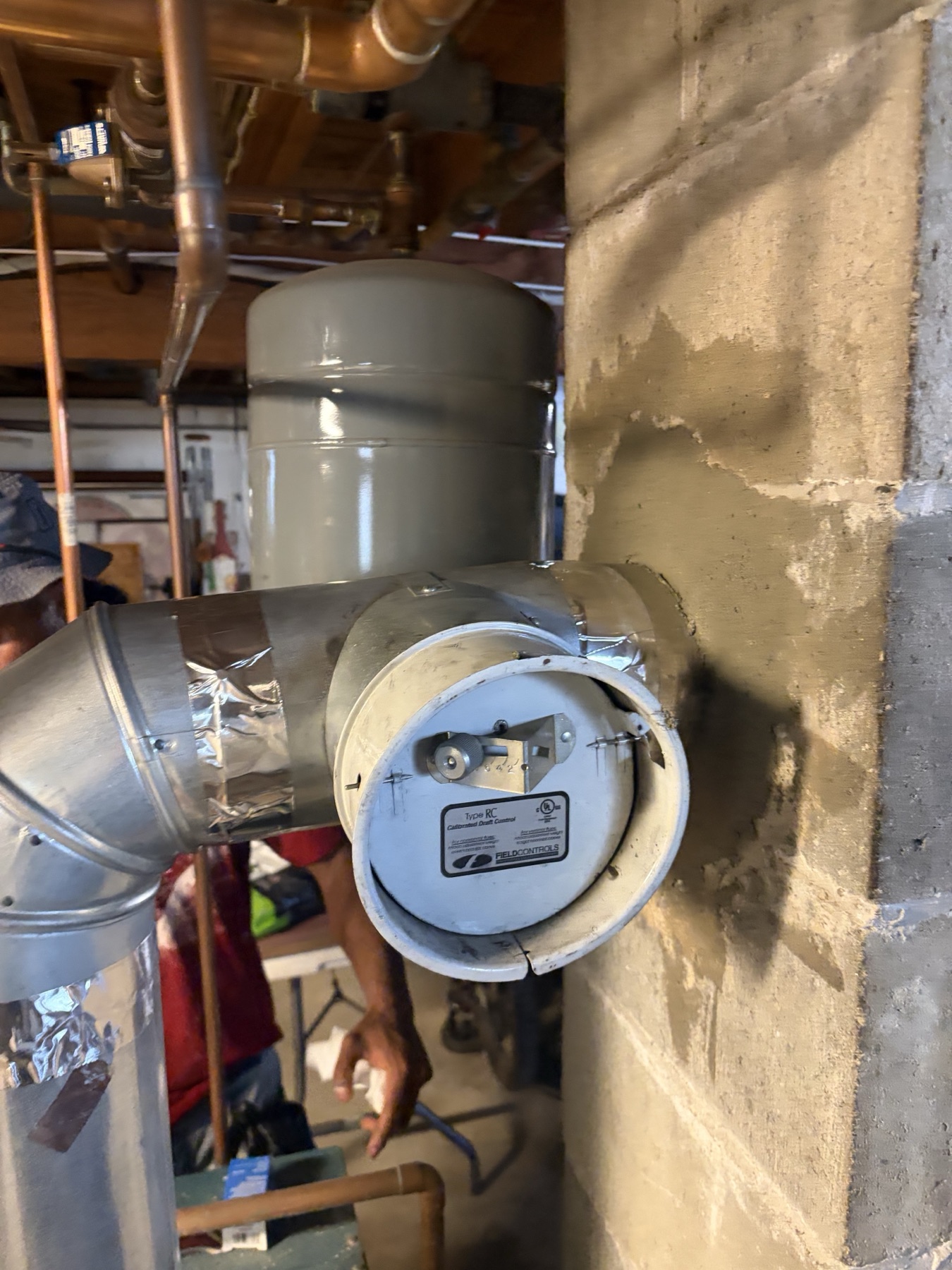 Heating system venting repair during chimney liner work in Methuen MA