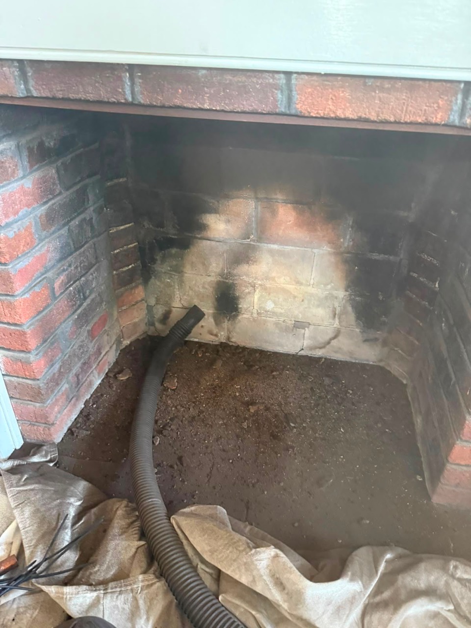 Deep fireplace cleaning during chimney sweep in Rockport MA