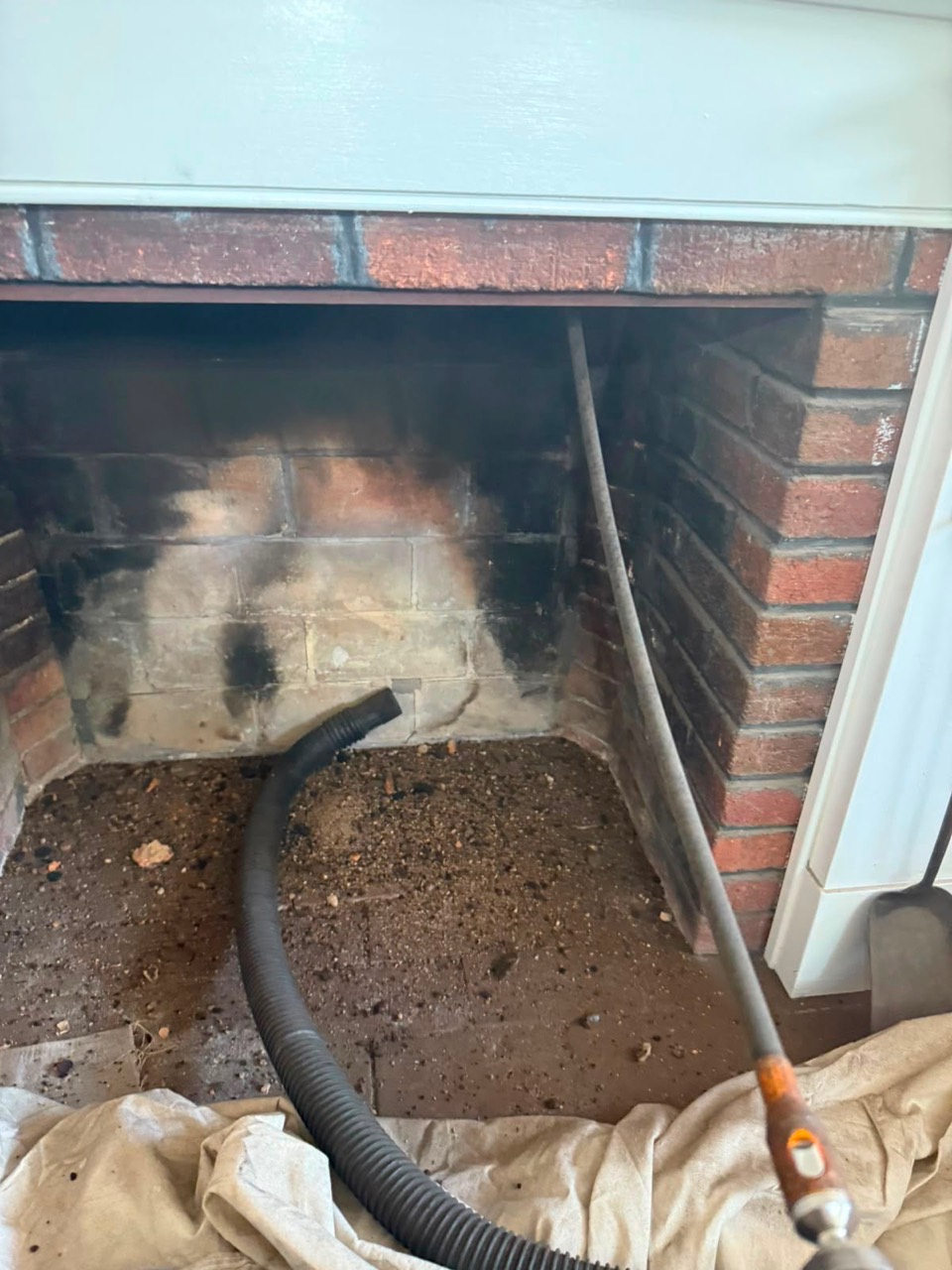 Fireplace debris removed during chimney cleaning in Rockport MA